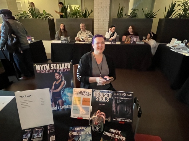 Shannon Lawrence! We Took "Stalky" Photos of Each Other and Sent Them to Each Other. We Sat Kattycorner From Each Other. COSine 2024 Author Signing. (© 2024, F. P. Dorchak)